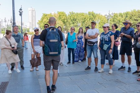 A guided tour at the Royal Palace in Madrid with tourists exploring the historic architecture.
